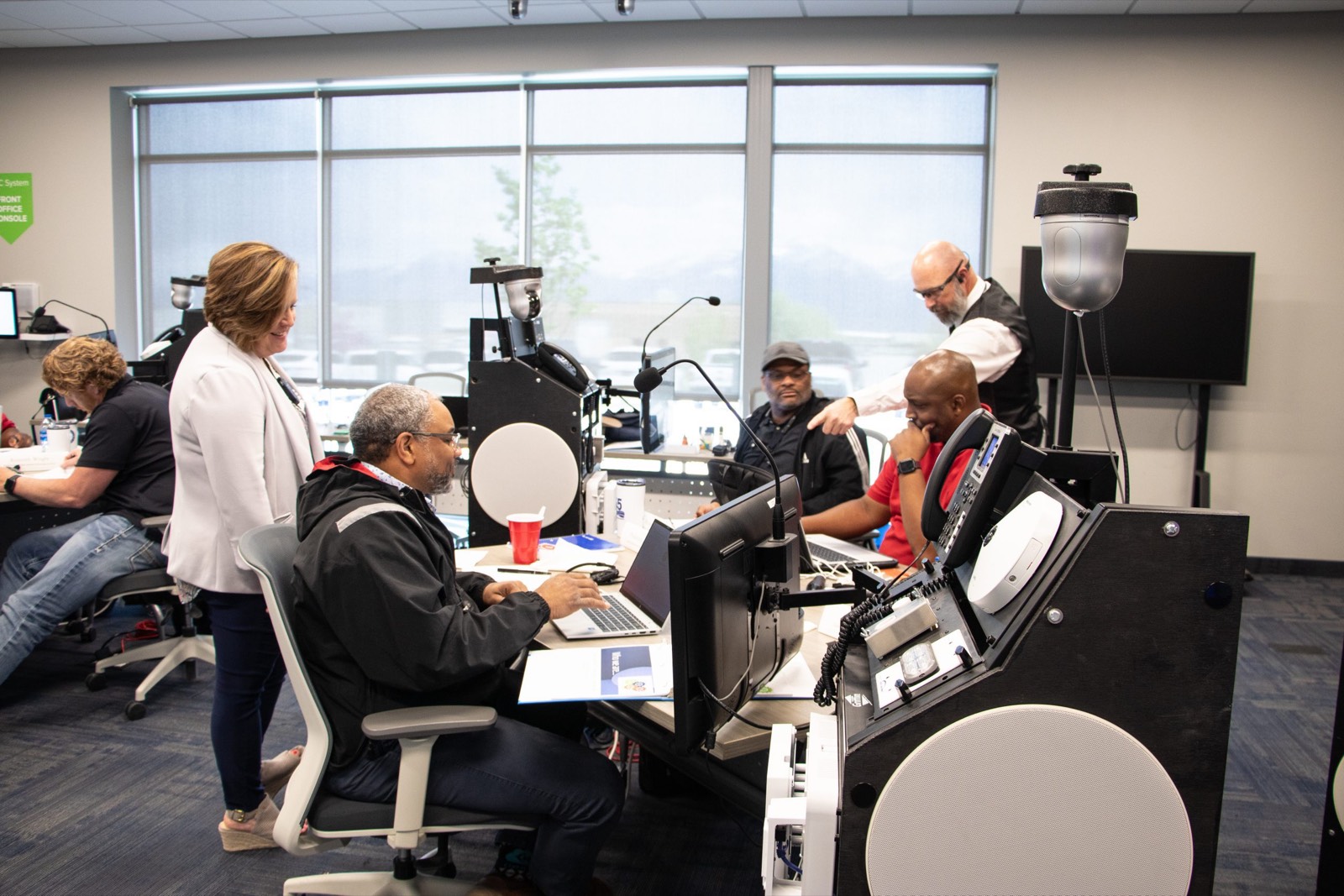 Technicians working at EPIC hardware benches during a training session